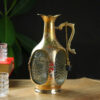 Old Monk Bottle in a decorative brass metal case
