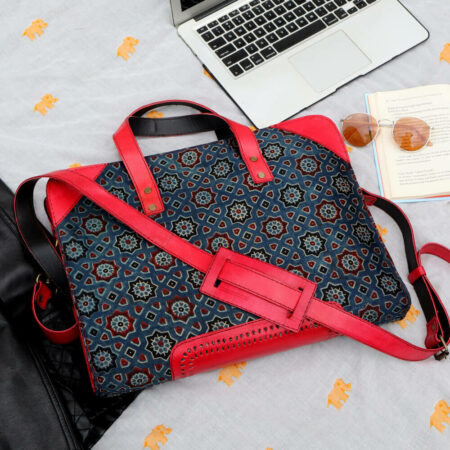 Add colour and style to everyday office aesthetics with our beautiful, ajrakh printed handcrafted kutch leather laptop bag.
