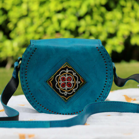 a handcrafted kutch leather blue sling bag